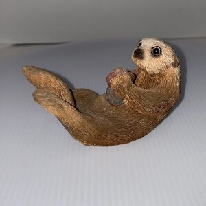 Vintage Sea Otter Floating On Back Holding Food Figurine